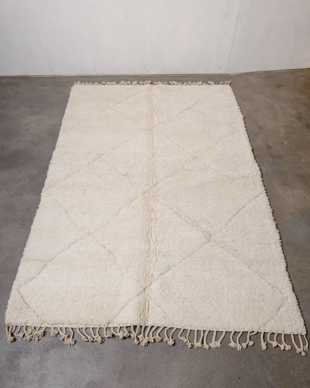 Modern, designer, handcrafted Berber rug from Morocco. Beniourain carpet with minimalist design, natural wool pile and a fluffy texture.